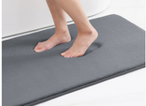 AquaHaven Decor memory foam bath mat with soft, absorbent surface and anti-slip backing, coastal bathroom decor style.