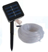 Waterproof AquaHaven Decor solar string lights hanging outdoors with coastal-themed design for home or Airbnb decor.