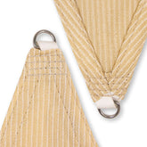 AquaHaven Decor waterproof triangle shade sail outdoors, providing stylish sun and rain protection over a patio area.