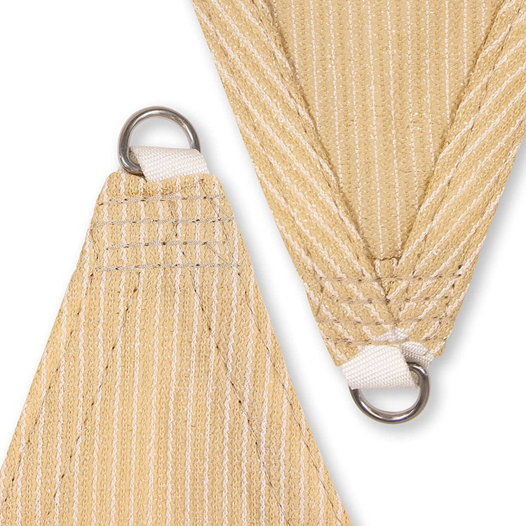 AquaHaven Decor waterproof triangle shade sail outdoors, providing stylish sun and rain protection over a patio area.