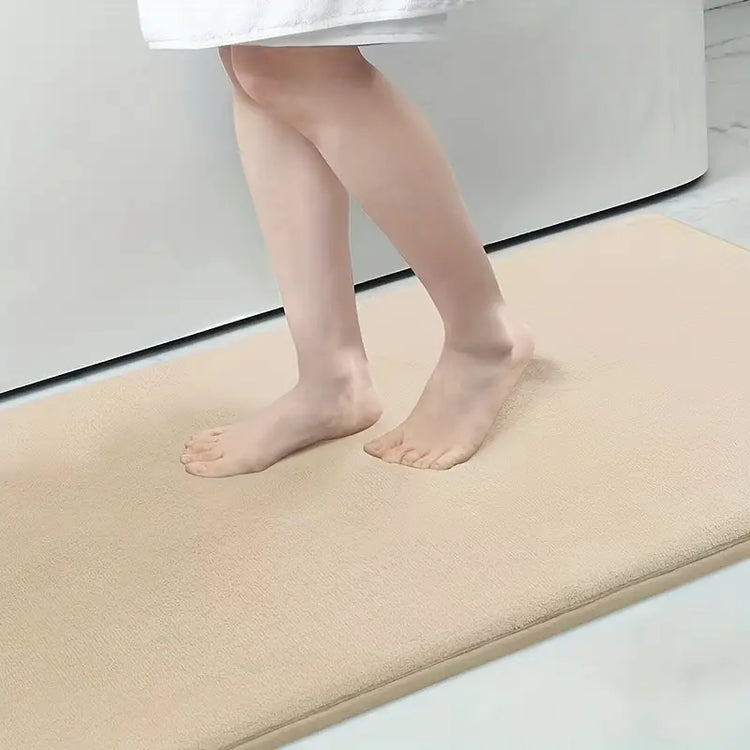 AquaHaven Decor memory foam bath mat with soft, absorbent surface and anti-slip backing for coastal bathroom decor.