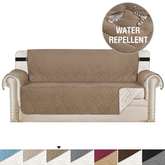 AquaHaven Decor waterproof velvet sofa cover with non-slip design, showing a cozy, fitted protective cover on a sofa.